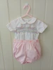 A lovely little button on suit, Size 3-6 month, Multi-coloured hand smocking, Pink whip stitch piping, Pink pique coloured button on pants, Elastic back waistband, Elasticated round the legs, Shirt made from 100% cotton poplin, Pants made from 100% cotton pique, Wash at 30 degrees