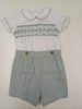 A lovely little button on suit, Size 12-18 month, Green and white coloured hand smocking, Forest Green coloured piping, Forest green coloured button on pants, Elastic back waistband, Elasticated round the back of the legs, Shirt made from 100% cotton poplin, Pants made from 100% sun-washed chambray, Wash at 30 degrees