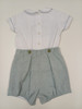 A lovely little button on suit, Size 12-18 month, Green and white coloured hand smocking, Forest Green coloured piping, Forest green coloured button on pants, Elastic back waistband, Elasticated round the back of the legs, Shirt made from 100% cotton poplin, Pants made from 100% sun-washed chambray, Wash at 30 degrees