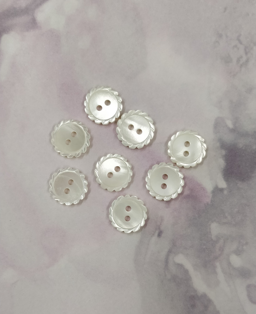 Beautiful mother of pearl buttons, Ideal for all your sewing projects
Wavy edge design with 2 holes, Size 16 (10 mm), Priced per button