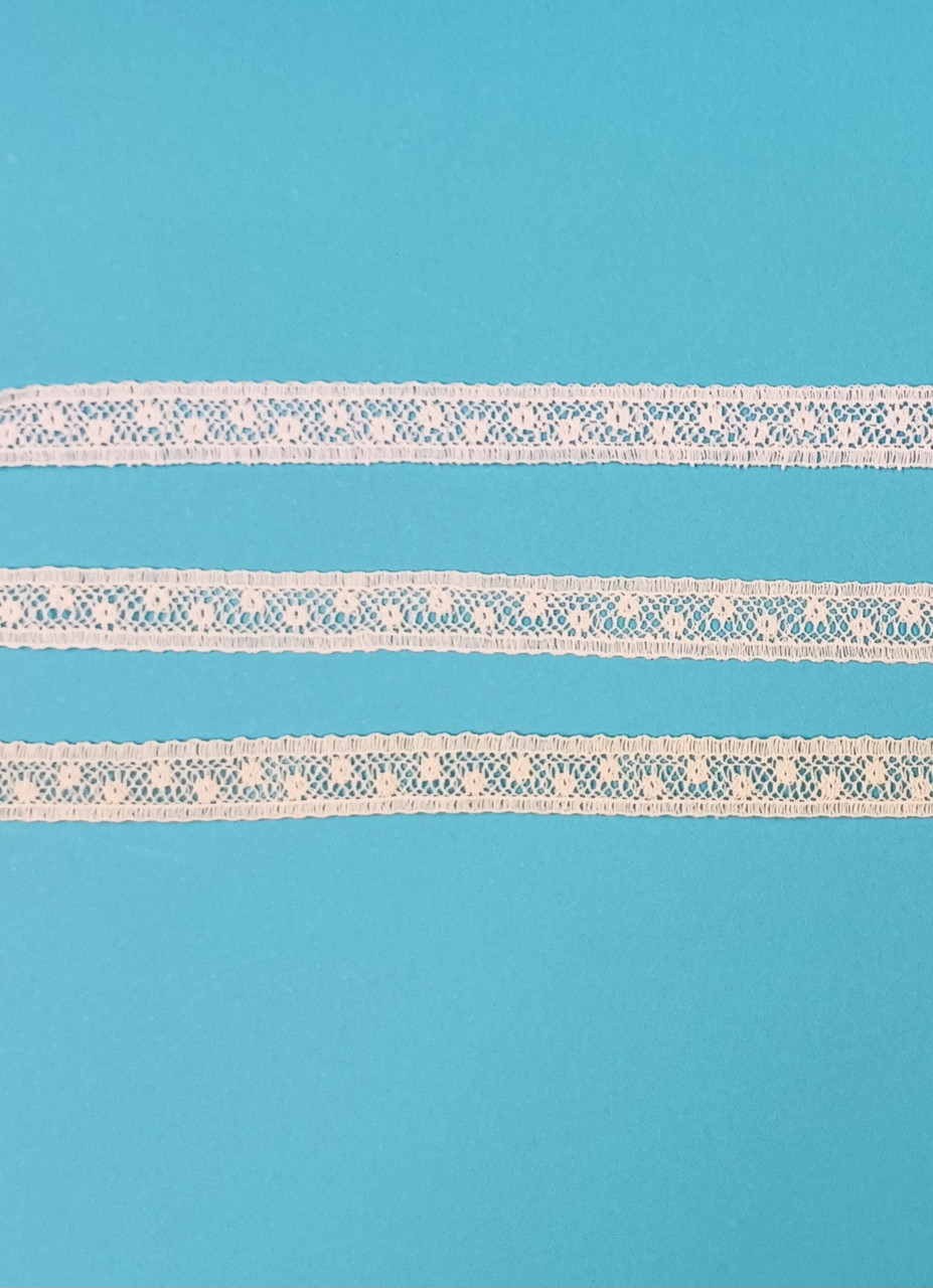 A narrow insertion lace, ideal for using to attach to ribbon hole lace, beading or edging lace or straight to fabric, a very useful simple pattern which goes well with other laces, 
1 cm wide, 95% cotton 5% nylon, Available in White, Off White and Ecru, Priced per metre