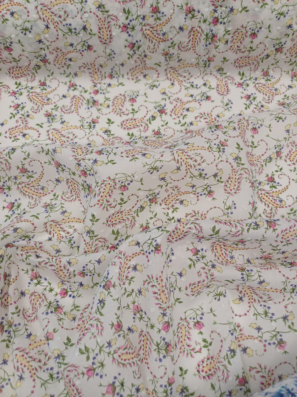 A really pretty floral print cotton, Almost a paisley design in pinks, yellows and purple, 100% cotton, 140 cm wide, Wash at 30 degrees, Ideal for shirts, dresses and more, Priced per metre 