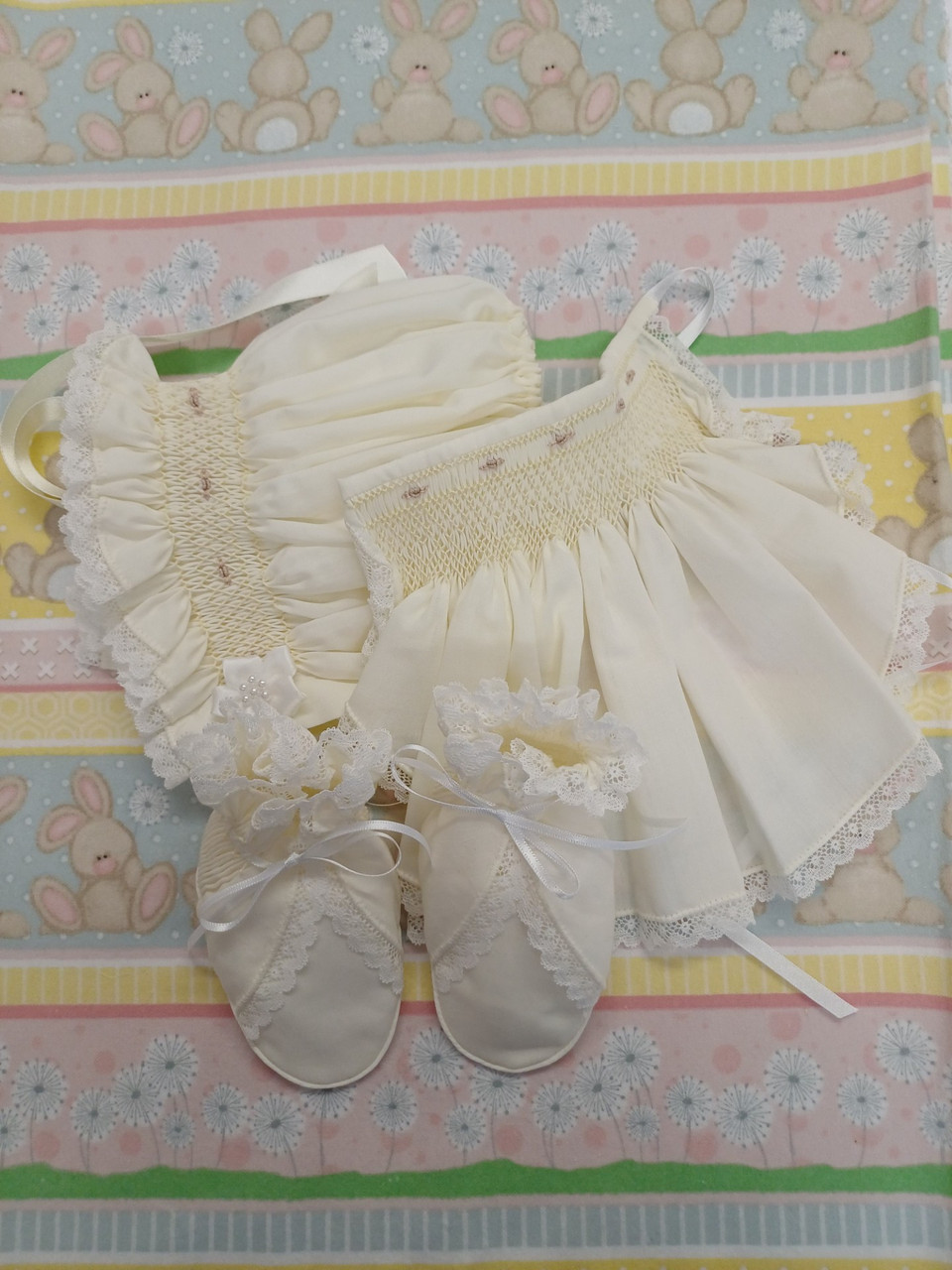 A beautiful bonnet, bib and bootee set, Sized to fit 3 -6 months, Made in Rice coloured imperial batiste, Wash at 30 degrees