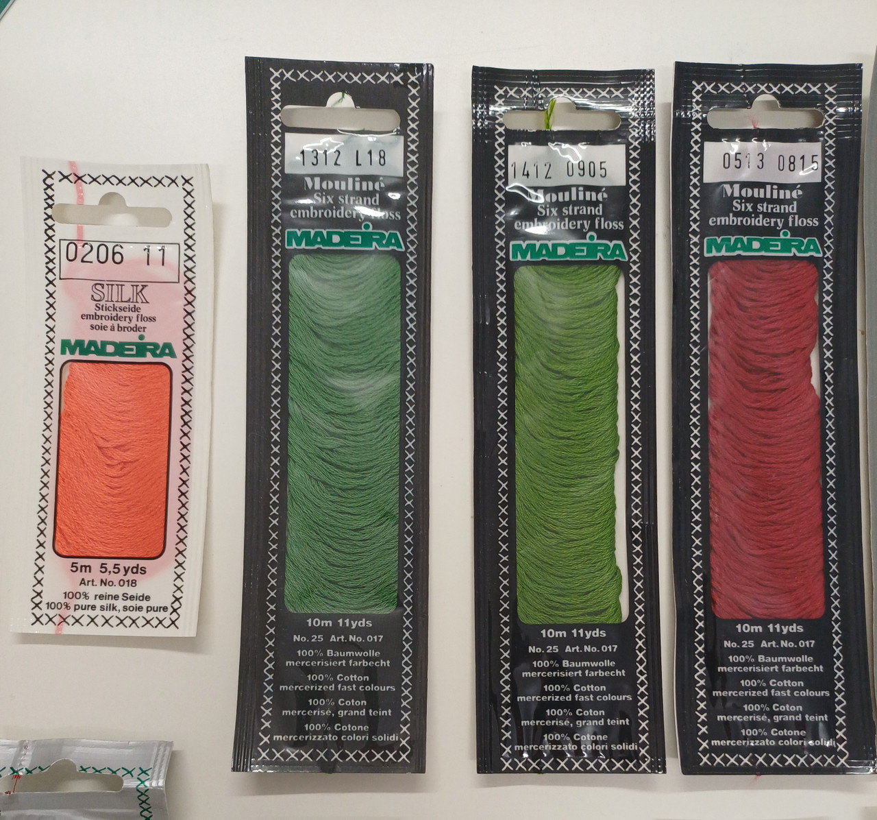 10 Mouline Madeira Six Strand embroidery floss numbers, 0101 L23, 0513 0815, 1312 L18, 1412 0905, 1713 L16, 1709 L15, 1908 L16, 1911 L14, 2007 L20,2009 L17,
2 x Mouline Stick Twist six strand floss numbers 0101 47, 1 x Metallic thread number 4 colour 4015, 1 x Silk embroidery floss 0206 11