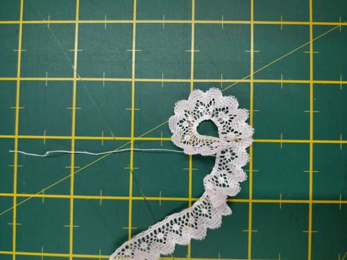 Spot and fan design edging lace 1.3 cm wide (HOS 7) - shown here gathered using the thread in the lace