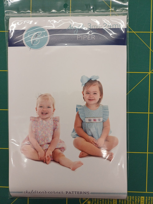 Piper is a fully lined bubble/romper featuring soft ruffles, The bodice can be customized with a smocked insert where it gathers on a raised waist, The bubble buttons in the back with a wrap-around facing for a couture finish, It features elastic casings at the legs with snaps or buttons at the crotch, Complete the look with an optional sash for an extra touch of sweetness, Smocking, Piper's Butterflies is included, 