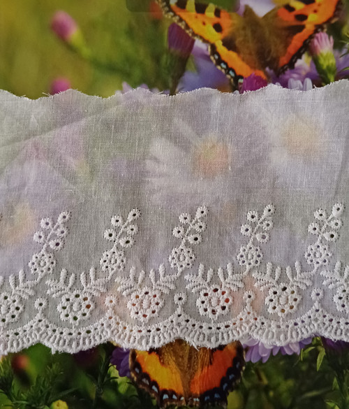 A pretty broderie anglaise trim, 10 cm wide, ideal for petticoats, dresses, collars and more, 100% cotton, Wash at 30 degrees, Priced per metre, Described as white books look more like ivory