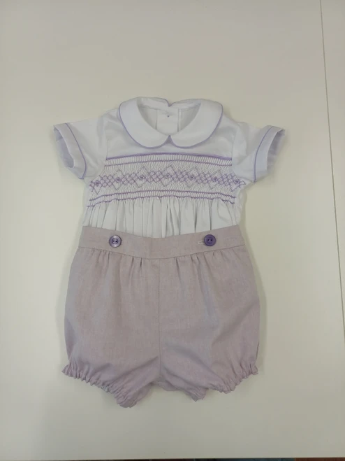 A lovely little button on suit, Size 6-12 month, wisteria coloured hand smocking, wisteria piping, Plum coloured button on pants, Elastic back waistband, Elasticated round the legs, Shirt made from 100% cotton poplin, Pants made from 100% sun-washed chambray, Wash at 30 degrees, 