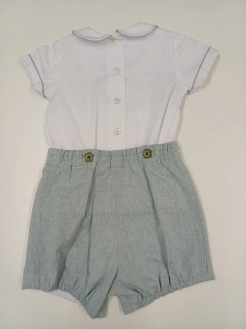 A lovely little button on suit, Size 12-18 month, Green and white coloured hand smocking, Forest Green coloured piping, Forest green coloured button on pants, Elastic back waistband, Elasticated round the back of the legs, Shirt made from 100% cotton poplin, Pants made from 100% sun-washed chambray, Wash at 30 degrees
