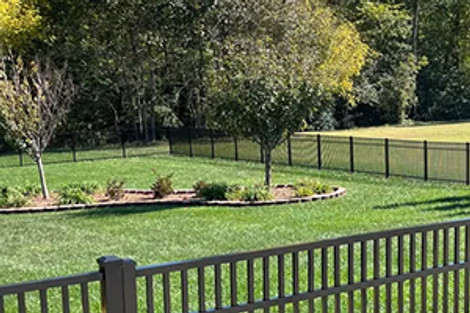 Enhancing Your Wooded Lot with Aluminum Fencing: A Perfect Blend of Elegance and Utility