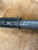 Tail section of KGM R6.5K Suppressor tucked under handguard