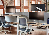 Ora monitor arm for hybrid office desks