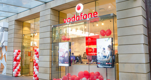 ATDEC Vodafone storefront with glass facade, red sign, and product ADBS-1-4FCF display installation. ATDEC Vodafone storefront with glass facade, red sign, and product ADBS-1-4FCF display installation.