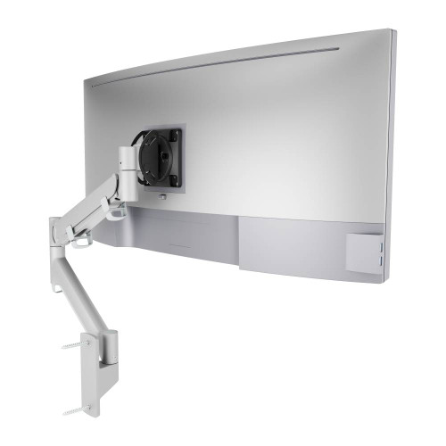 ATDEC AWMS-HXW Silver dynamic wall mount supporting large monitor with spring-assisted arm for smooth operation.