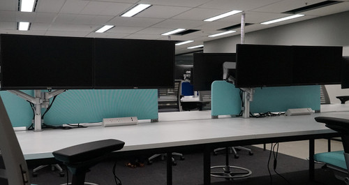 ATDEC AWMS-2-D40 White ergonomic dual monitor arm for sit-to-stand desks with 27" screen capacity.