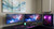 ATDEC AWMS-2-5940 White dual monitor arms holding two 34" curved monitors on a workstation desk setup.