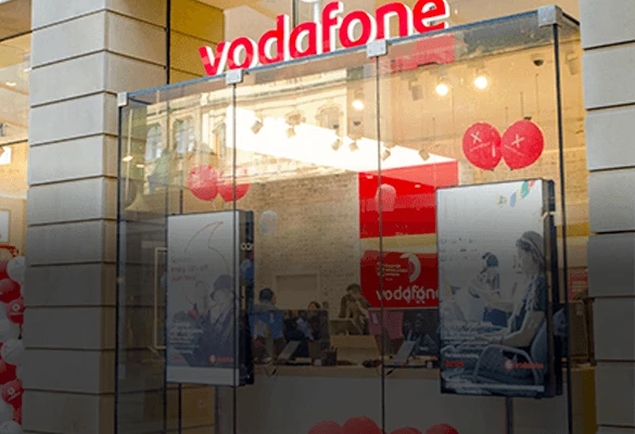 In-window digital signage display mount in a retail storefront