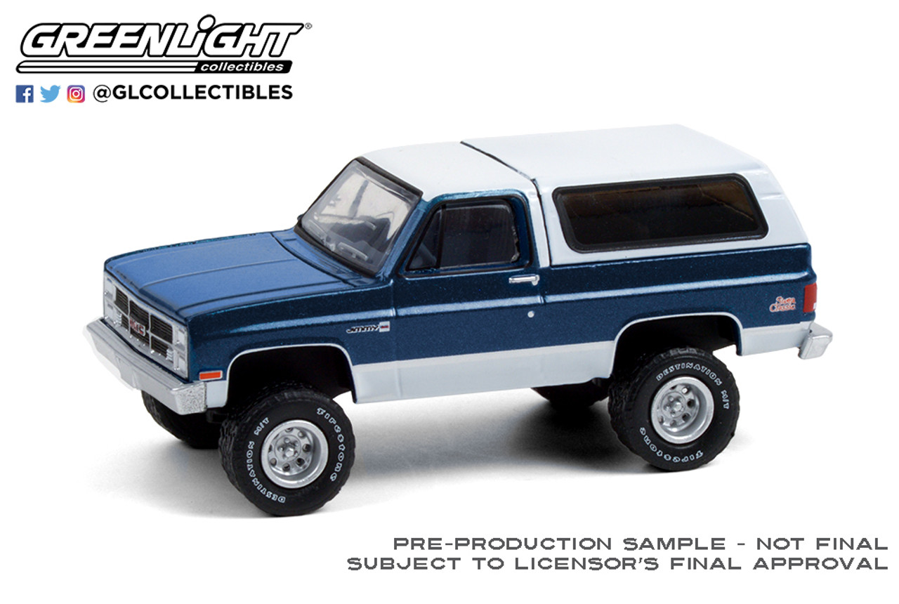 1:64 All-Terrain Series 11 - 1987 GMC Jimmy Sierra Classic Square Body,  Lifted - Dark Blue and White