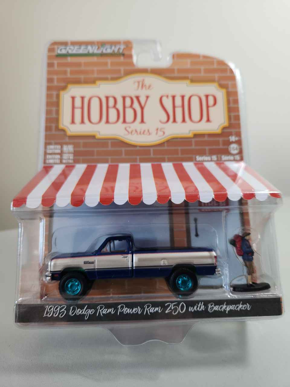 1:64 The Hobby Shop Series 15 - 1993 Dodge Power Ram 250 with Backpacker  Green Machine by GreenLight