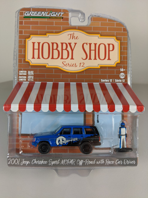 1:64 The Hobby Shop Series 12 - 2001 Jeep Cherokee Sport MOPAR Off-Road with Race Car Driver