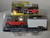 1:64 2015 Chevrolet Silverado in Red with Tool Box and Enclosed Car Hauler in White 