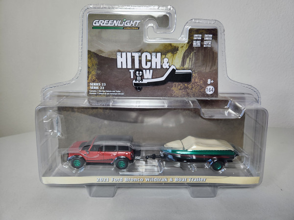 1:64 Hitch & Tow Series 23 - 2021 Ford Bronco Wildtrak in Rapid Red Metallic with Boat Trailer
