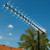 Lifestyle image of the 91XG Antenna with mast outside on roof