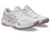 Pair of ASICS indoor court shoes in white with soft pink accents, shown from a front angled view, highlighting the breathable mesh upper, cushioned midsole, and non-marking outsole designed for indoor volleyball and court sports.