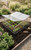 The Frost Shield 110 E2 four-lid polycarbonate cold frame greenhouse