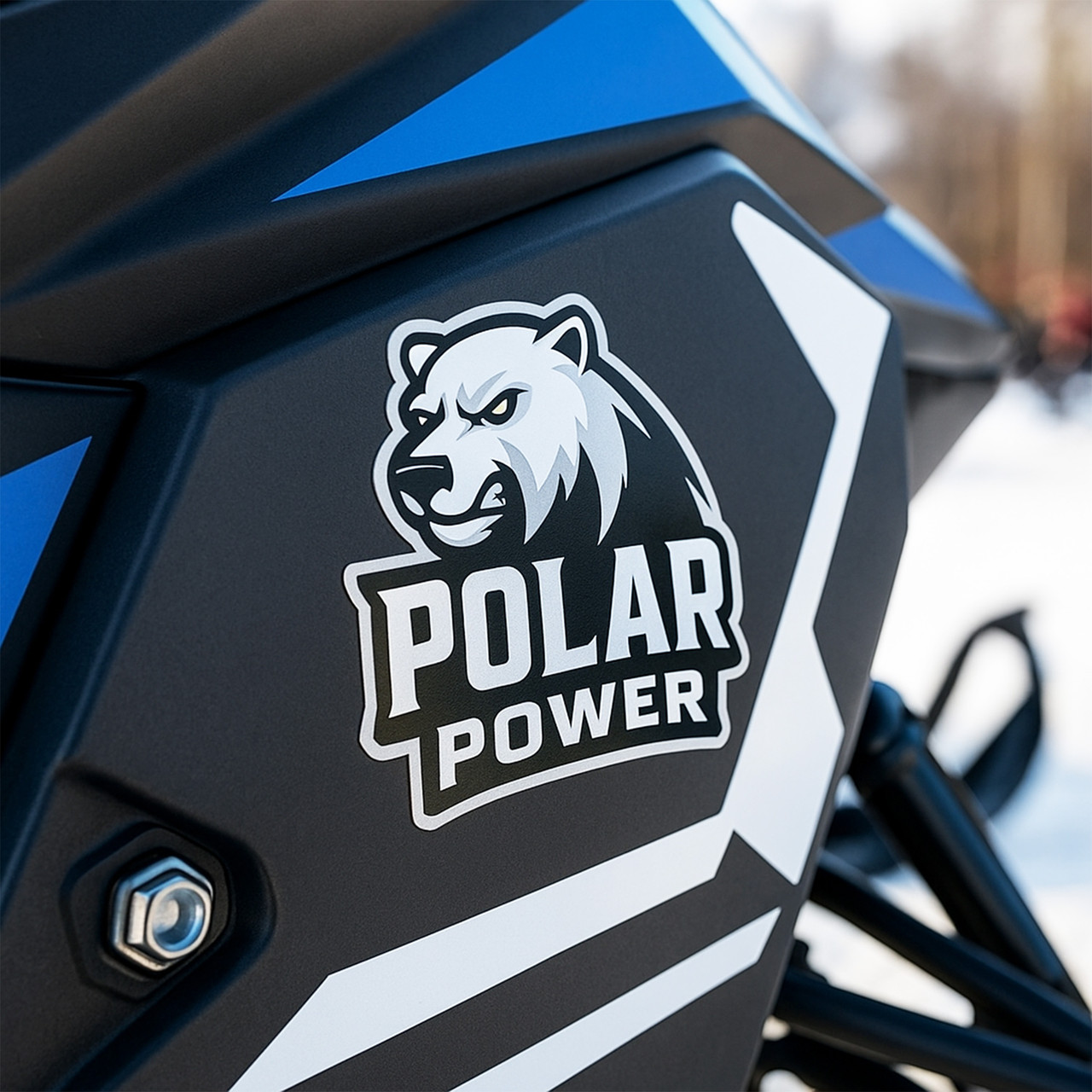Decal of an aggressive polar bear head with the words “POLAR POWER” in bold white font on a black and blue vehicle.