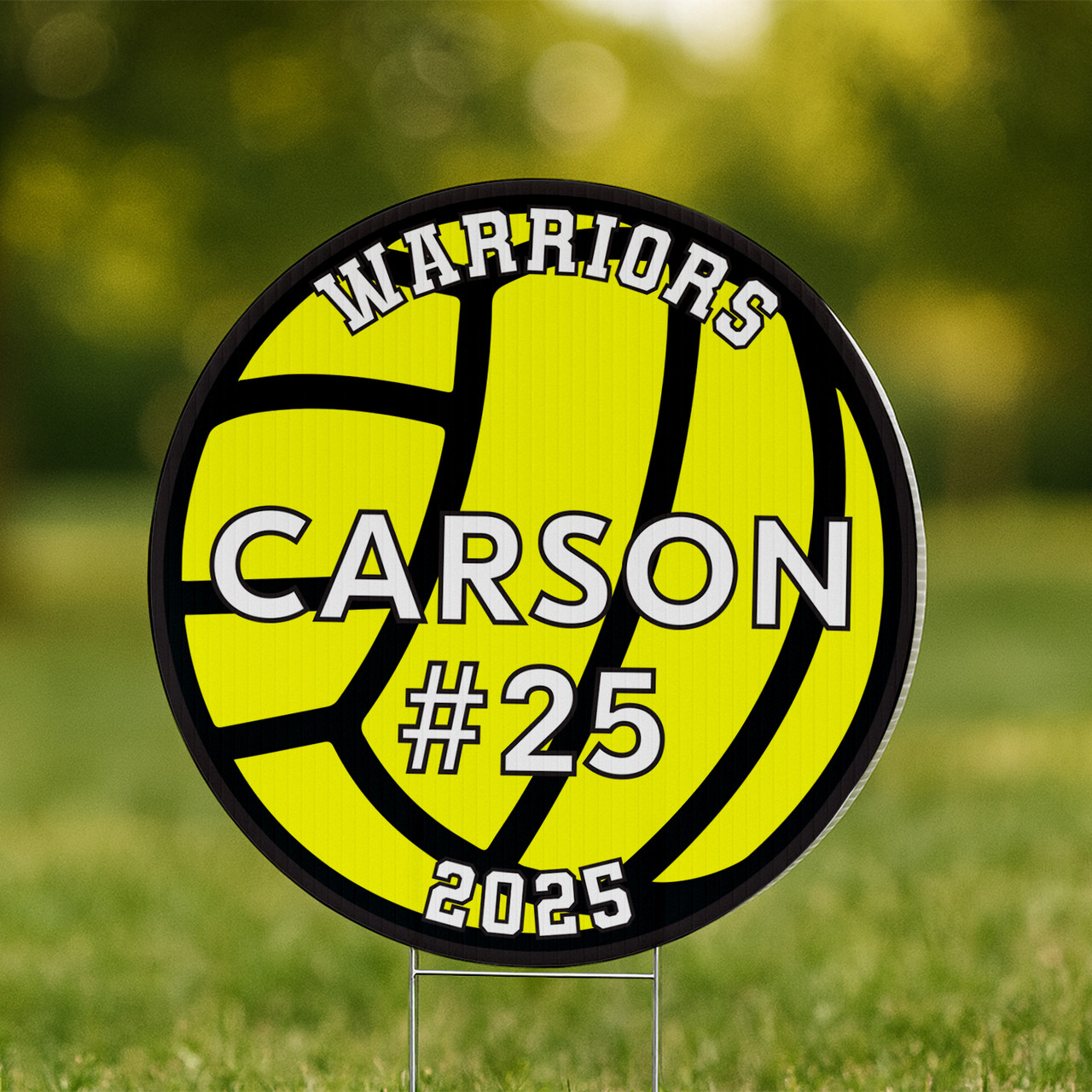 Bold yellow and black volleyball yard sign personalized with “CARSON #25” and “WARRIORS 2025”, staked into the lawn in front of a brick house.