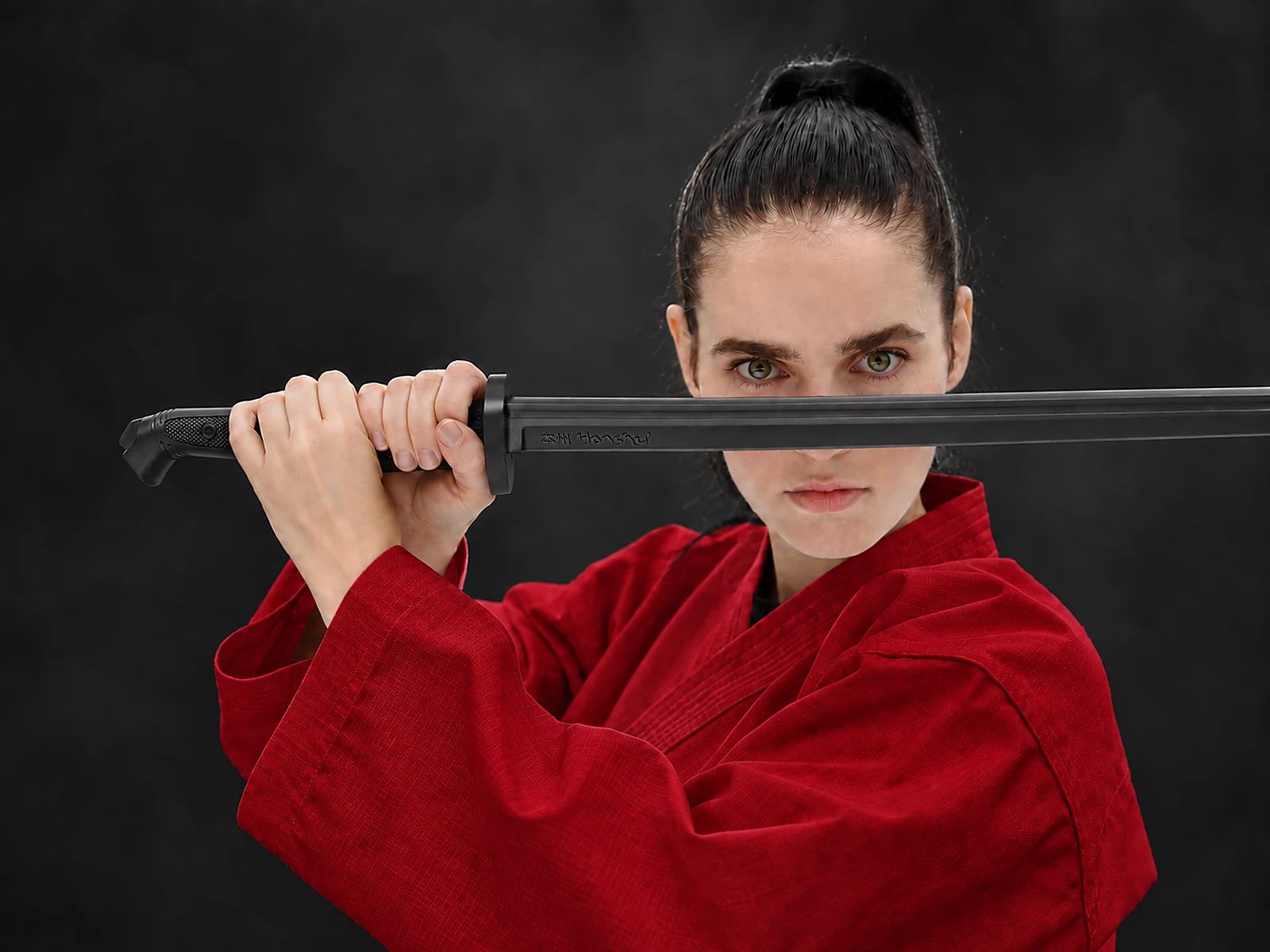 Person in a red uniform holding a Honshu Training Katana