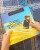 Two hands of child holding Saint Dominic book