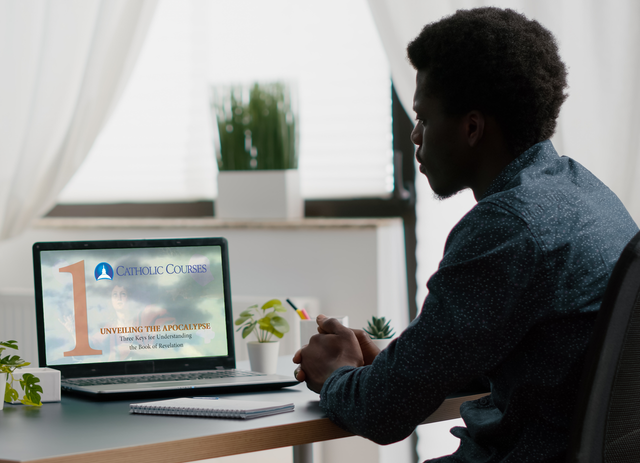 A man watching the course on a laptop