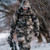 hunter wearing fortress walking in the woods