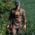 hunter wearing featherweight walking a tree line