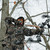 hunter wearing alpha elite drawingn a bow in a tree stand