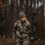 women hunter walking in the woods