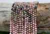 Rhodonite Polished 4mm Faceted Round - Banded