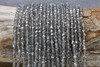 Glass Crystal Polished 4mm Faceted Round - 1/2 Coated Transparent Grey