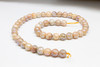 Sunstone Polished Coated 8mm Faceted Round