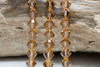 Swarovski Crystal Light Smoke Topaz 5328 6mm Bicones