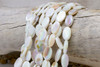 Natural Shell White 15x10mm AB Plated Polished Oval