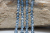 Swarovski Crystal Aquamarine Satin 5328 4mm Bicones