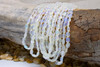 Ethiopian Opal Polished 4-7.5mm White Smooth Ovals - Graduated