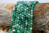 Striped Agate Polished A Grade 6mm Green Mix Round