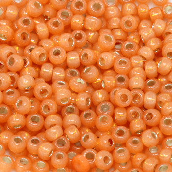 Size 6 Toho Seed Beads -- 553A Pumpkin Opal / Gilt Lined