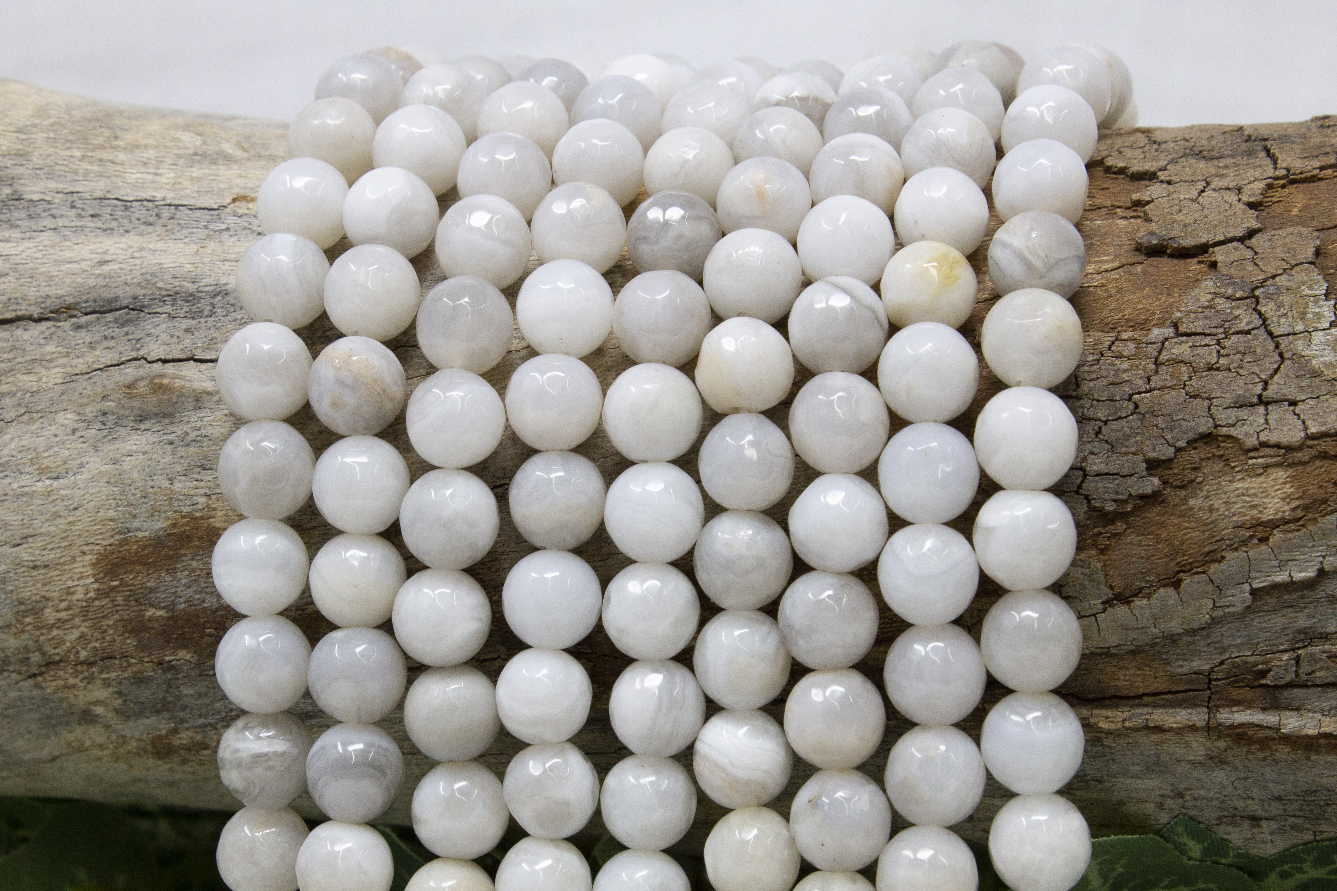 White Crazy Lace Agate Polished 8mm Faceted Round - Bead World