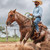 Cowboy riding a horse wearing a Poncho The Marfa shirt