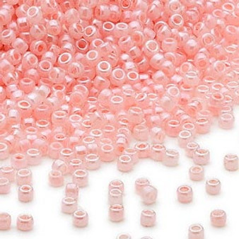 Seed bead, Dyna-Mites™, glass, opaque ceylon pastel pink, #11 round. Sold per 40-gram pkg.